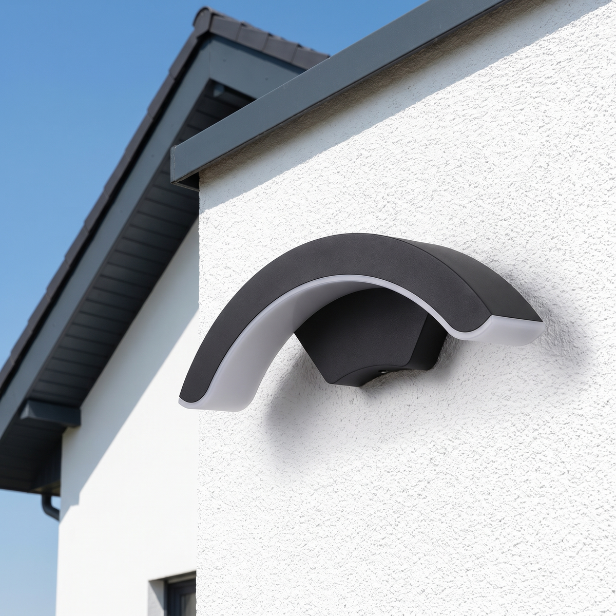 StormLite wall light in daylight on a white rendered wall, matte black finish unmarked