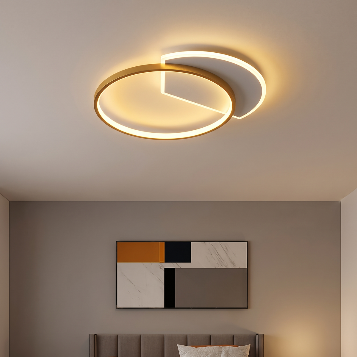 Orbit ringed flush ceiling light lit warm on a bedroom ceiling