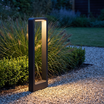 Aluminium arch garden light beside a gravel path