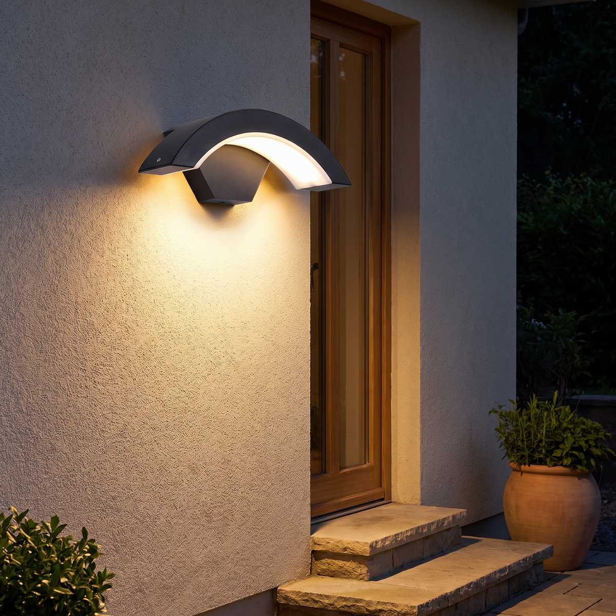 Crescent sensor wall light above exterior steps