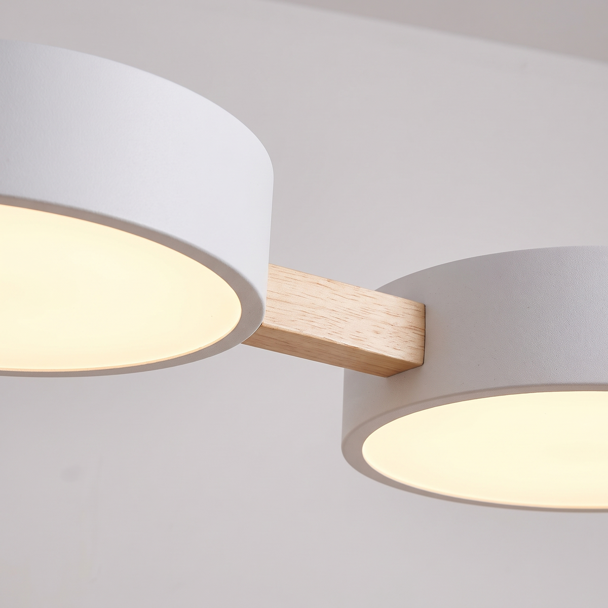 Detail of two Tavola shades joined by a short angled wood strut
