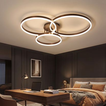 Ripple ceiling light lit warm in a study at true scale