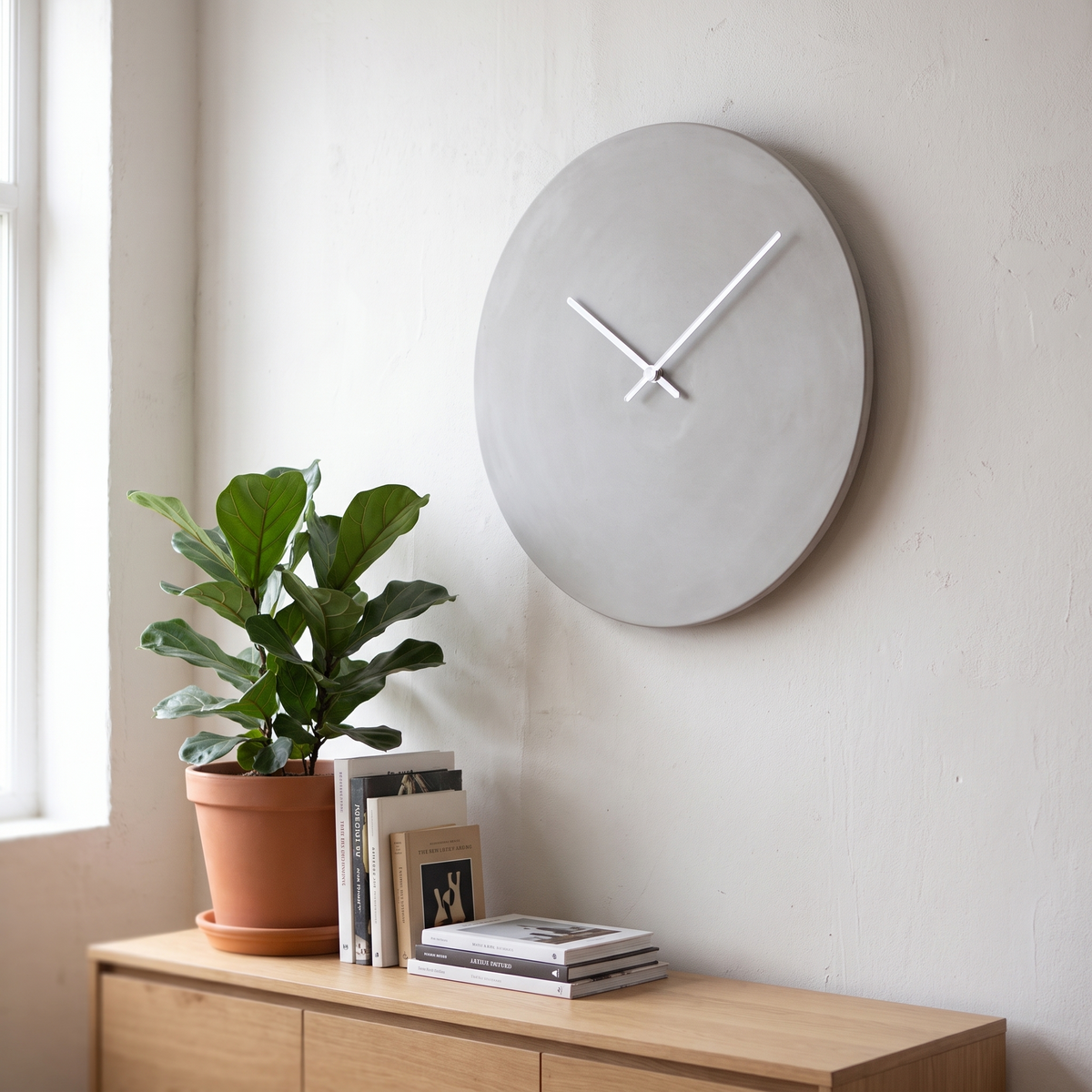 Slate minimalist concrete-look wall clock above a sideboard