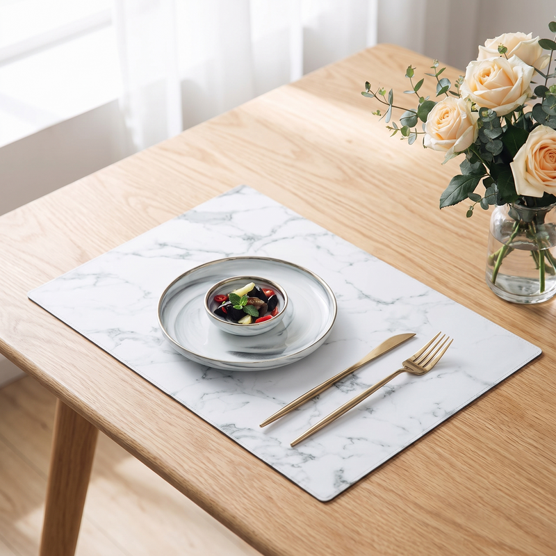 Quarry marble-look placemat laid with a plate and gold cutlery