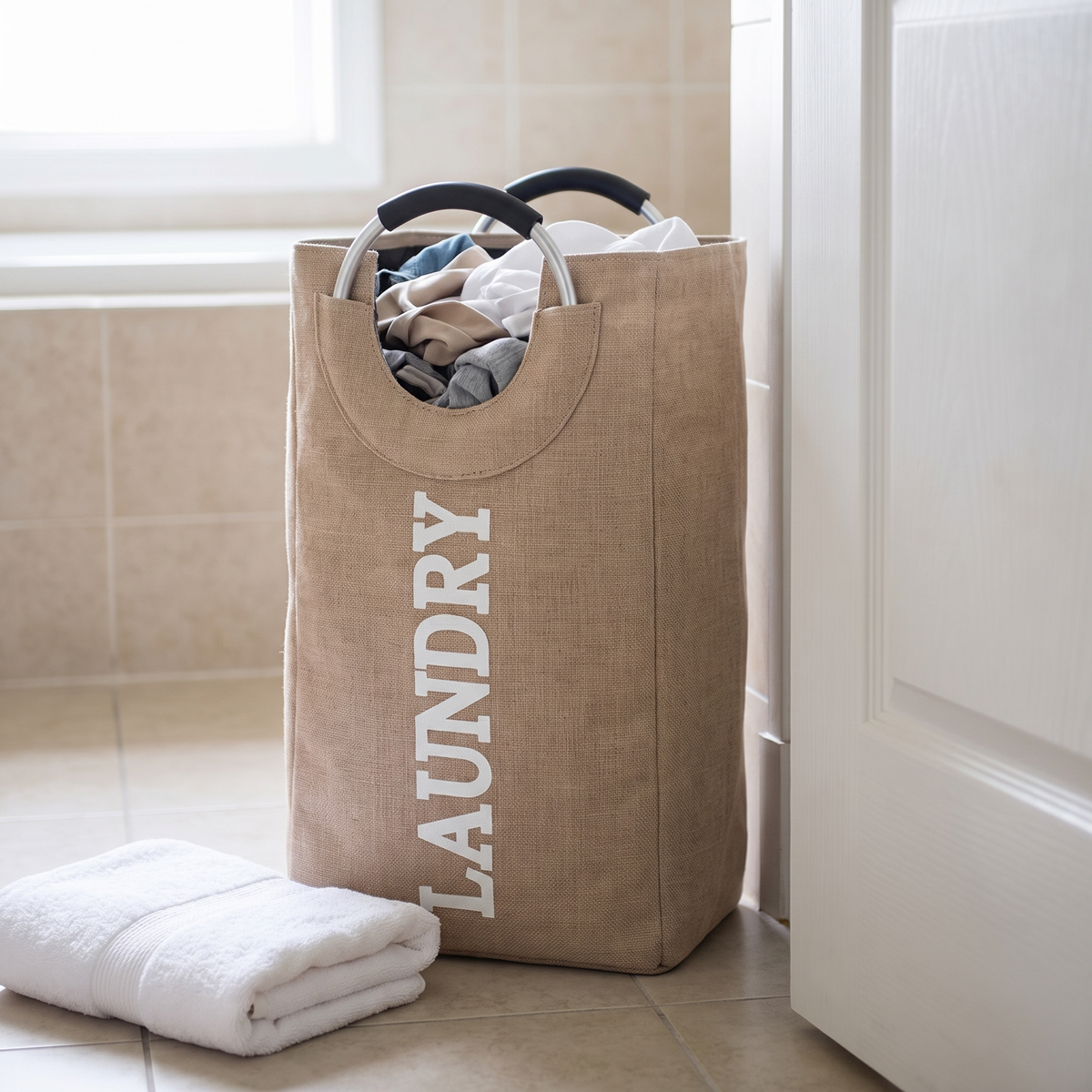 Fold collapsible linen laundry hamper in a bathroom